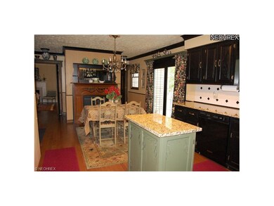 Custom glazed cabinetry, granite counters, and a m