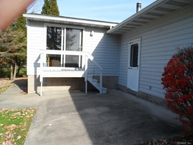Sliding doors from the den lead to a private patio
