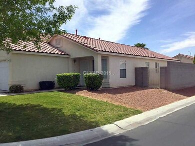 Property Photo. The front yard has a grass area, s
