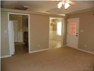 Living Room looking toward front door & Kitchen/Dining Area