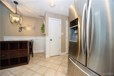 Dining area, featuring a wainscoted wall, stainles