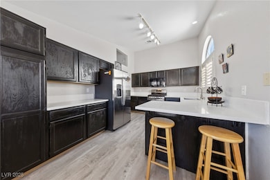 Kitchen with stainless steel appliances, a sink, a