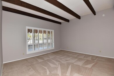 Living room w/beamed ceiling