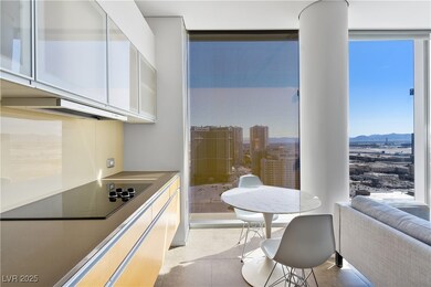 Kitchen featuring expansive windows, white cabinet
