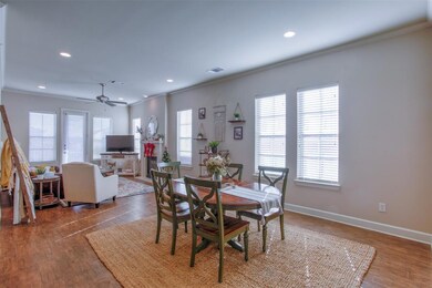The dining and living rooms are open to the kitche