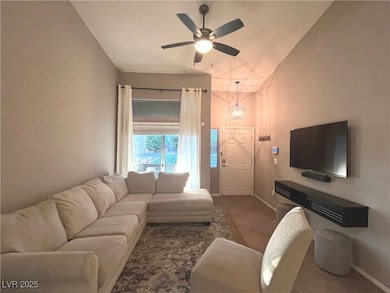Family room with vaulted ceilings, ceiling fan & light that opens to the dining area and kitchen.