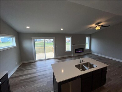 Similar to but no fireplace but larger window ther