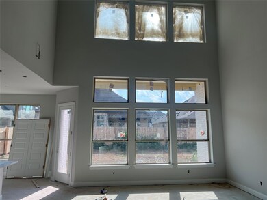 Entrance foyer featuring baseboards and a high ce