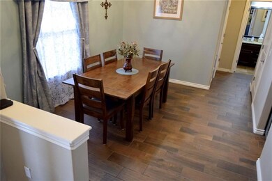 Formal Dining Room with Ceramic Wood Tile Flooring