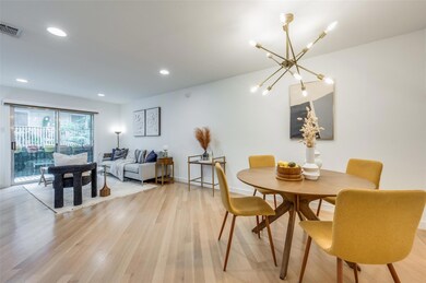 Dining room featuring a chandelier and light hardwood / wood-style flooring