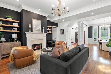 View of Living Room looking to Dining and Foyer