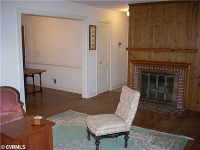 Living Room - with brick fireplace flanked by cabi