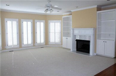 Lots more natural light in family room, built in bookcases & new  carpet