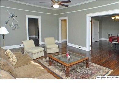Crown molding and picture railing throughout.