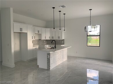 Kitchen, island bar + dining room