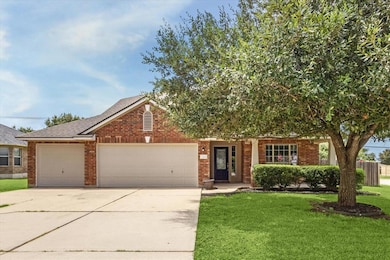 View of front of home with concrete driveway, fen