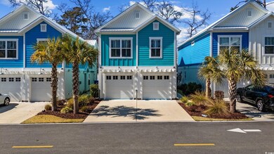 View of front of house with a garage, driveway, an