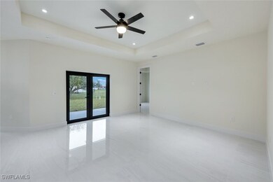 This spacious living room features elegant French