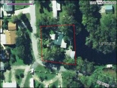 Aerial of vacant canal front lot on Maple