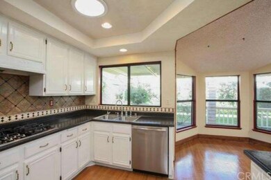 Kitchen opens to the breakfast nook and family roo