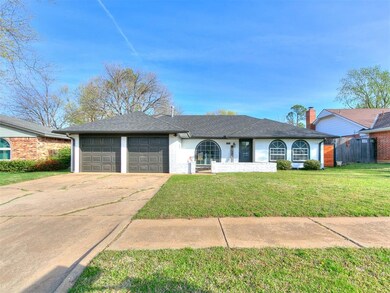 Ranch-style home featuring driveway, roof with shi