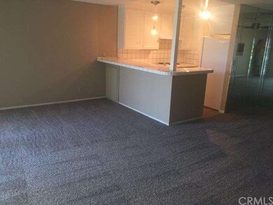 Living room, dining area, has new carpet, ceiling 