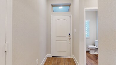 Entry and Powder Room off the Foyer.