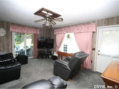 Family Room. Cute Living Room has nice carpet.