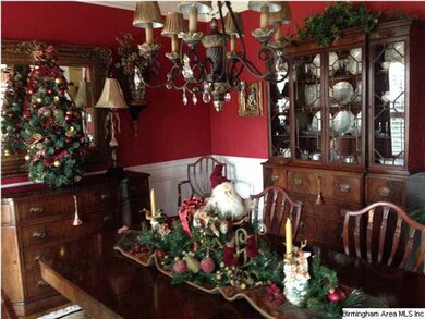 Spacious formal Dining Room with crown molding, wa