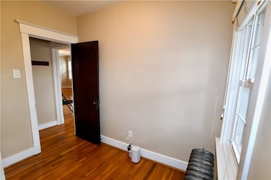 Office with coat closet-storage at top of stairs l