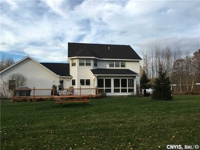 Exterior Front. Party size deck with three season