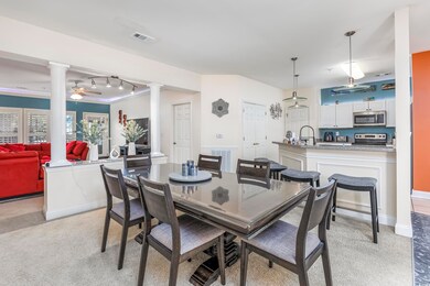 Dining room featuring ceiling fan, ornamental mold