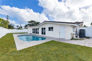 Spacious backyard with pool and privacy fence