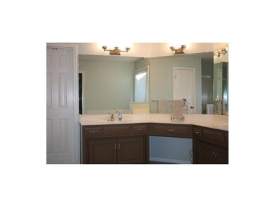 The master bath boasts a whirlpool tub, double van