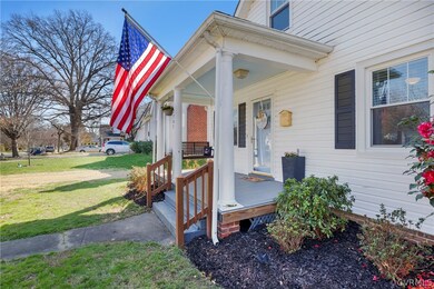 Entrance to property with a yard and a porch