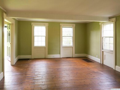 Living room with original trim & moldings on w
