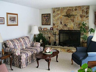 Living Room. STONE WOODBURNING FIREPLACE WITH GAS 