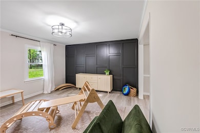 Flex room featuring light wood-type flooring, orna