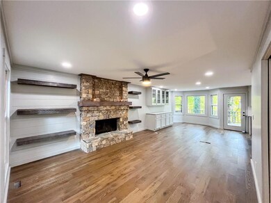 Unfurnished living room with hardwood / wood-style