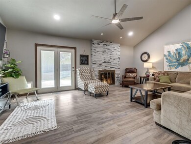 Living room featuring a fireplace, light hardwood 