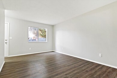 Unfurnished room with dark wood finished floors