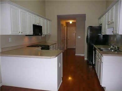 Wonderful kitchen has sparkling white cabinetry, R