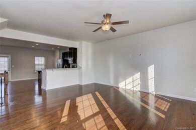 Gleaming hard wood floors throughout den and kitch