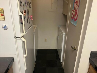 Washroom featuring washer / dryer, electric panel
