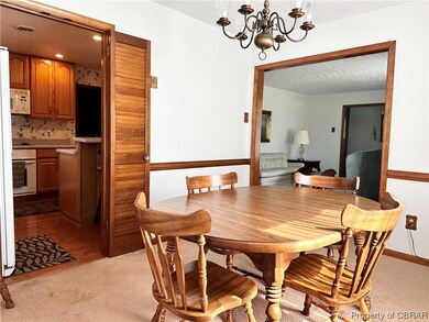 Dining area featuring light carpet