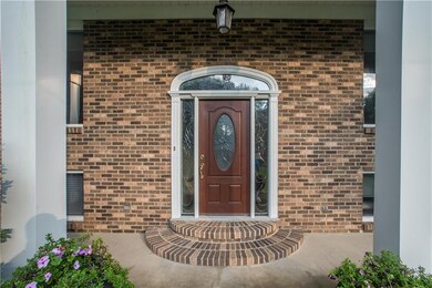 The front door has matching stained glass in door,