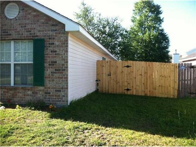 Photo. Wood Privacy Fence Secures Rear Yard
