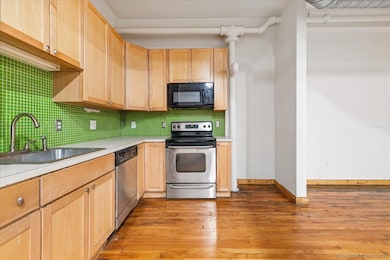 Beautifully laid out updated kitchen with stainless steel appliances, lots of cabinet space and open floor plan to dining room and living room