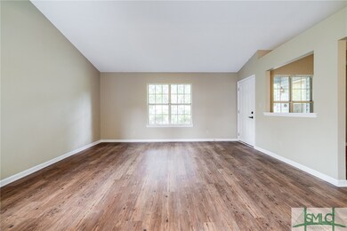 Standing in dining room looking to front of house.