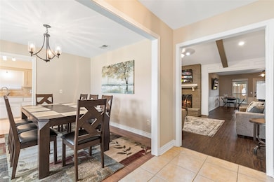 Dining space featuring a fireplace, visible vents,